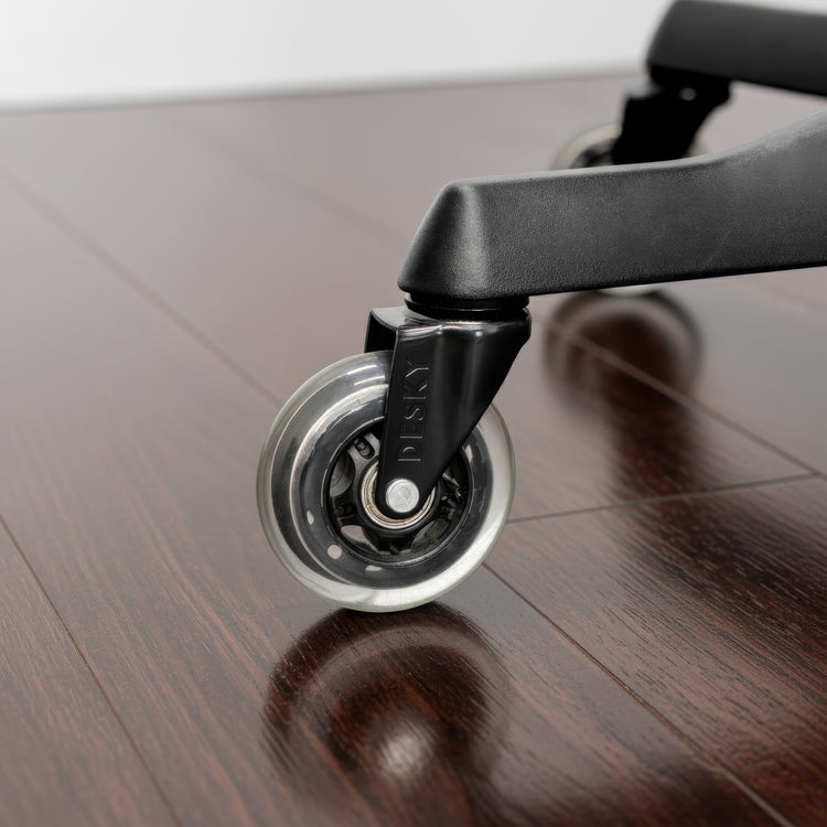 Desky office chair caster wheels in clear on hardwood floor