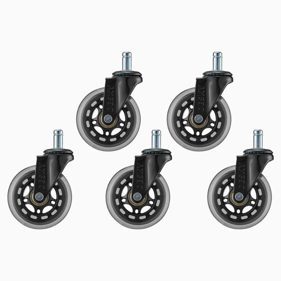 Rubber caster wheels on black chair in front of desk