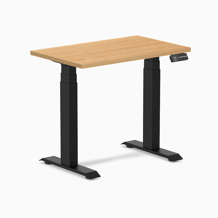 Desky Dual Mini Hardwood Sit Stand Desk, 32x20 inch maple top, matte black frame, and digital control panel.