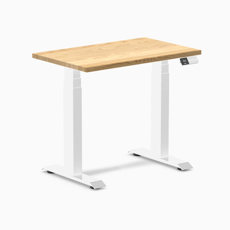 Desky Dual Mini 32x20 inch White Oak hardwood sit-stand desk with white frame and digital display.