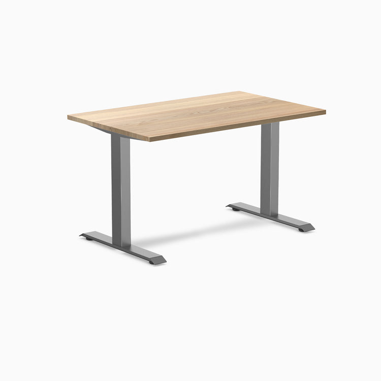Desky Zero fixed-height office desk with a White Ash hardwood top and Space Gray steel frame.