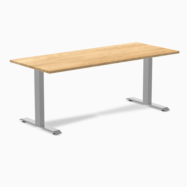 Desky Zero hardwood office desk with a light White Oak top and gray steel frame.