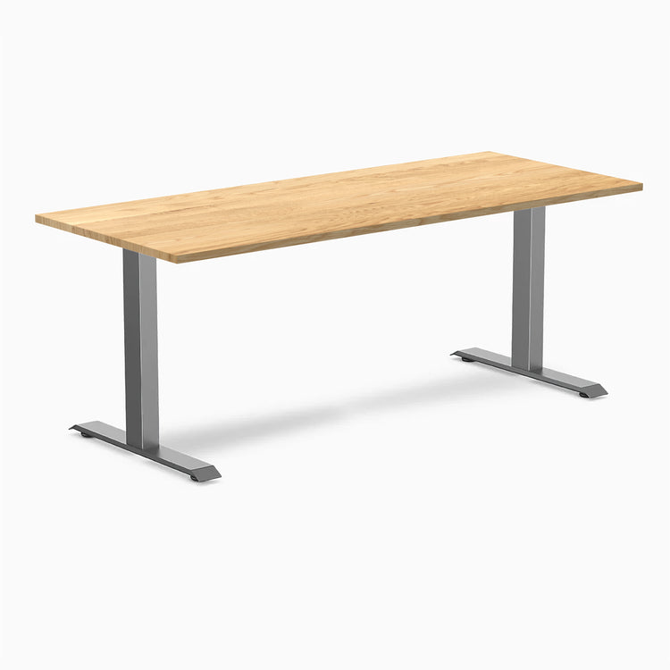 Desky Zero fixed-height office desk with White Oak hardwood top and Space Gray steel frame.