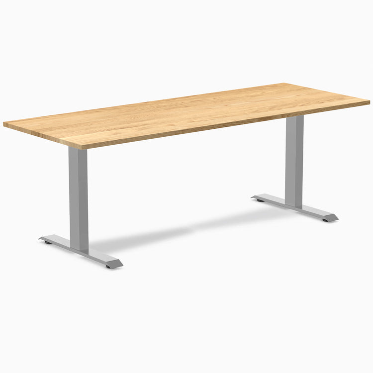 Desky Zero ergonomic office desk with a White Oak hardwood top and gray steel frame.
