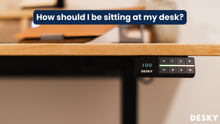 How should I be sitting at my desk?
