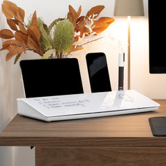 White Desky Desktop Whiteboard with notes, a tablet, smartphone, and marker on a wooden desk.