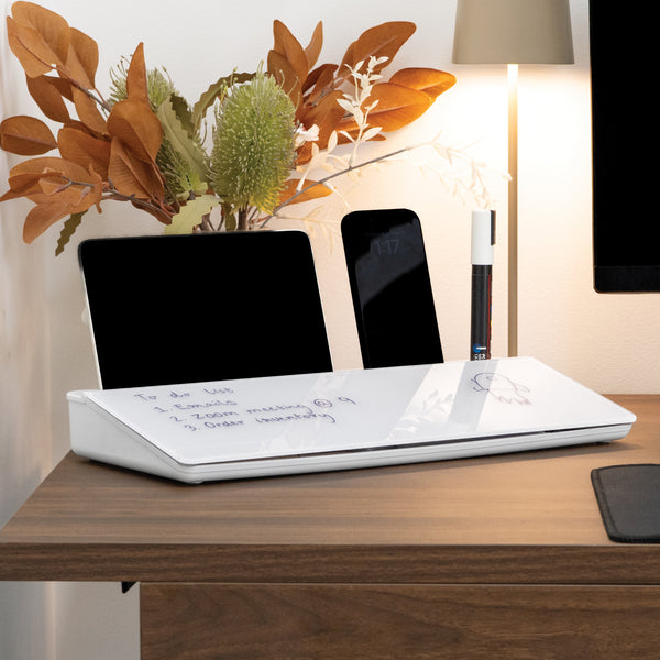 White Desky Desktop Whiteboard with notes, a tablet, smartphone, and marker on a wooden desk.