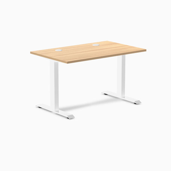 Desky Zero fixed height office desk with Sublime Teak laminate top, white steel frame, and two grommets.