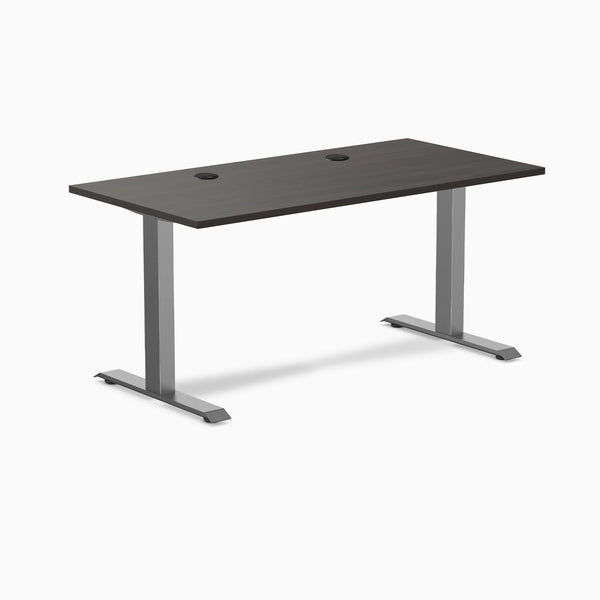 Desky Zero fixed height office desk with burnished wood laminate top, grommets, and space gray steel frame.