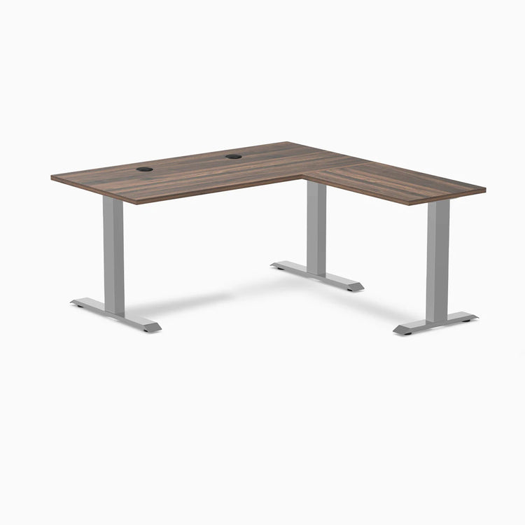 Desky Zero L-shape office desk with Jarrah Legno laminate top, gray steel frame, and grommets.