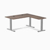 Desky Zero L-shape office desk with Jarrah Legno laminate top, gray steel frame, and grommets.