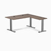 Desky Zero L-shape office desk with Jarrah Legno laminate top, Space Gray steel frame, and grommets.