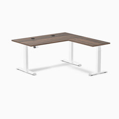 Desky L-Shape Laminate Sit Stand Desk with Jarrah Legno top, white legs, and grommets.