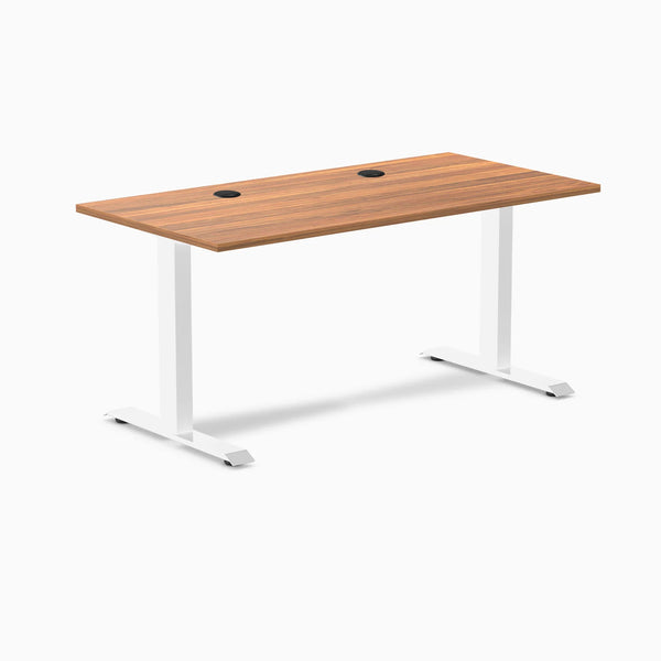 Desky Zero fixed height office desk with Prime Oak laminate top, white steel frame, and two grommets.