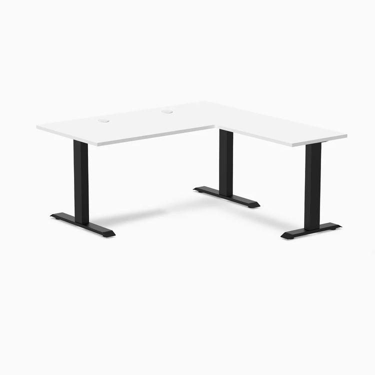 White laminate L-shape office desk with matte black steel frame and grommets.