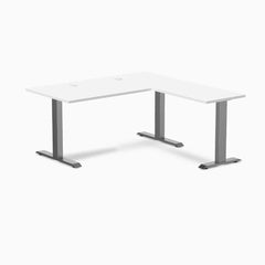 White Desky Zero Laminate L-shape office desk with Space Gray steel frame and grommets.