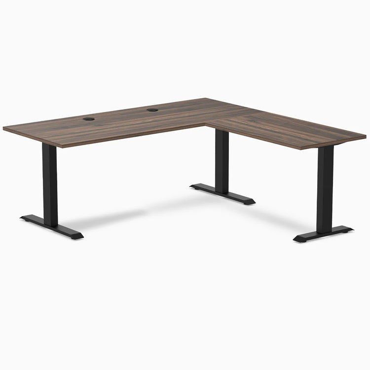Desky Zero L-shape office desk with Jarrah Legno laminate top, matte black steel frame, and grommets.