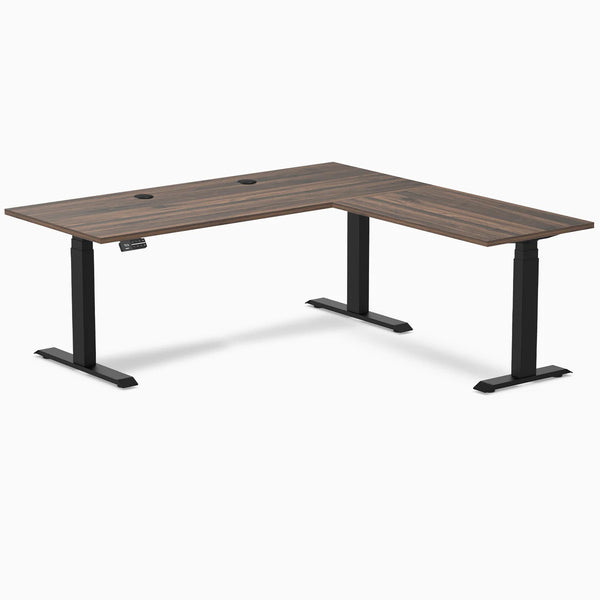 Desky L-Shape Laminate Sit Stand Desk in Jarrah Legno with Matte Black legs and grommets.