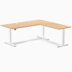Desky L-Shape Laminate Sit Stand Desk in Sublime Teak with white frame and grommets.