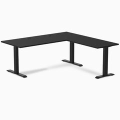 Black Desky Zero Laminate L-shape office desk with grommets and matte black steel frame.
