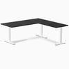 Black laminate L-shape office desk with white steel frame and grommets.