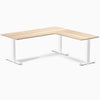Classic Oak L-shape office desk with white steel frame and two grommets on a white background.