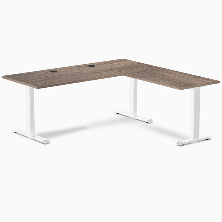 Natural Walnut L-shape office desk with white steel frame and grommets.