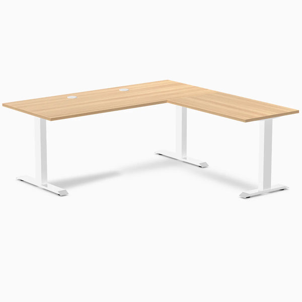 Sublime Teak laminate L-shape office desk with white steel frame and grommets.