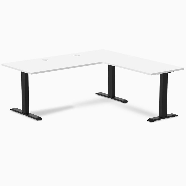White laminate L-shape office desk with matte black steel frame and grommets.
