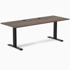Desky Zero fixed-height office desk with Jarrah Legno laminate top, black steel frame, and two grommets.