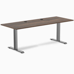 Desky Zero fixed height office desk with Jarrah Legno laminate top, Space Gray steel frame, and grommets.