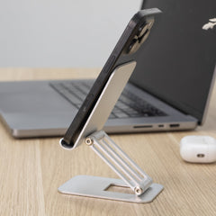Silver phone stand on top of desk