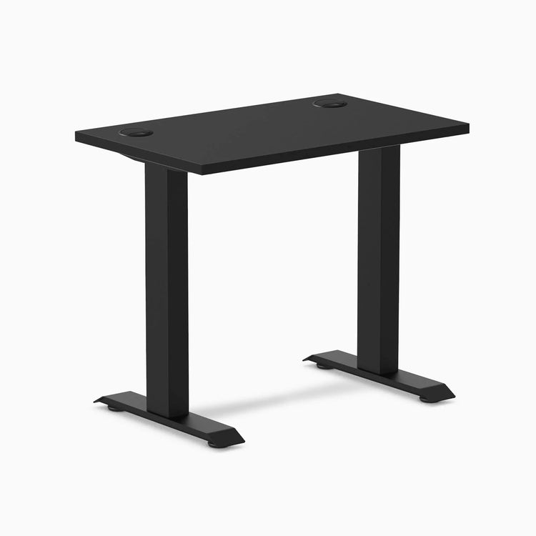 Desky Zero Mini fixed-height desk, 32x20 inch matte black top with grommets, black legs.
