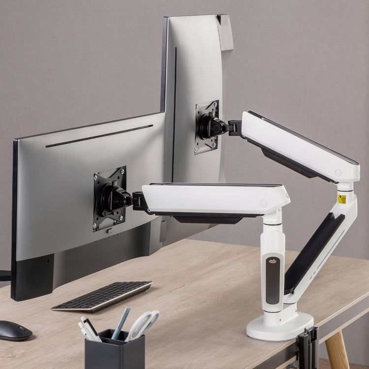 Dual LED monitor arm in white on desk