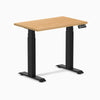 Desky Dual Mini Hardwood Sit Stand Desk, 32x20 inch maple top, matte black frame, and digital control panel.