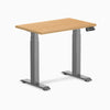 Desky Dual Mini Hardwood Sit Stand Desk with maple top and space gray frame.