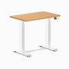 Desky Dual Mini hardwood sit-stand desk with maple top, white frame, and digital control panel.