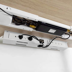 White mini cable and management tray under standing desk