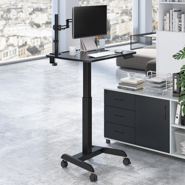 Electric single pedestal desk with monitor arm and monitor attached 