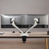 Dual LED monitor arm in white with monitors