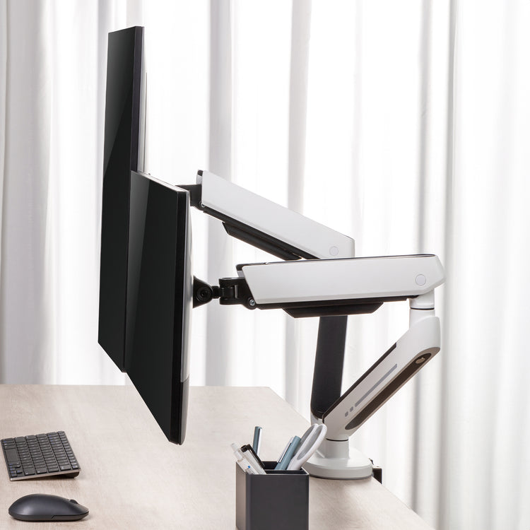 Dual LED monitor arm in white in office setting