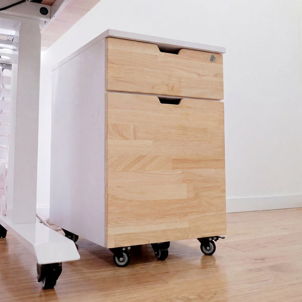 Desky white and natural wood filing cabinet with two drawers, one lockable, on casters.
