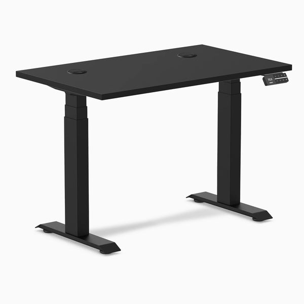 Black Desky Dual Mini sit-stand desk, 40x24 inch matte black top with grommets, compact design.