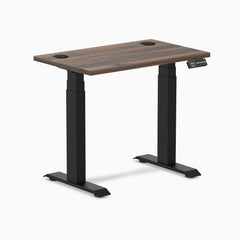 Desky Dual Mini sit stand desk with Jarrah Legno top, matte black legs, 32x20 inches, and grommets.