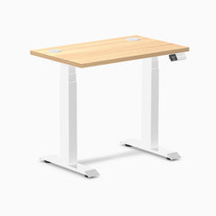 Desky Dual Mini sit-stand desk with a Sublime Teak 32x20 inch top, white frame, and grommets.