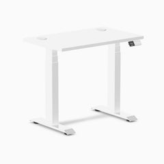 White Desky Dual Mini sit-stand desk, 32x20 inches, with grommets and digital height display.
