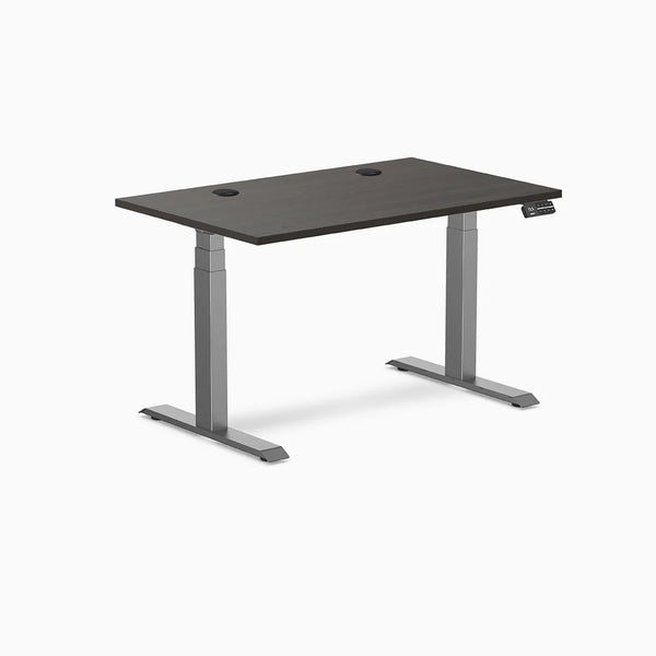 Desky Dual Laminate Sit Stand Desk with burnished wood top, two grommets, and space gray frame.