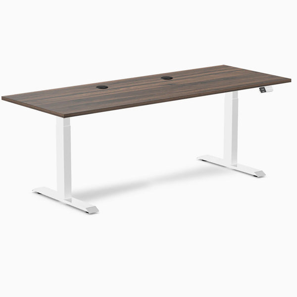 Desky Dual Laminate Sit Stand Desk with Jarrah Legno top, white frame, and two grommets.