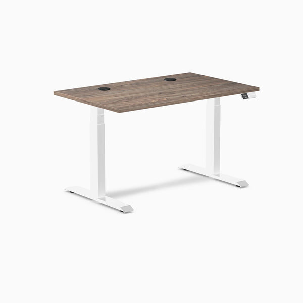 Desky Dual sit-stand desk with natural walnut laminate top, white frame, and two grommets.