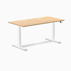 Desky Dual sit-stand desk with Sublime Teak laminate top, white frame, and two grommets.